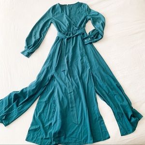 Emerald green maxi dress, slits, and faux pearls